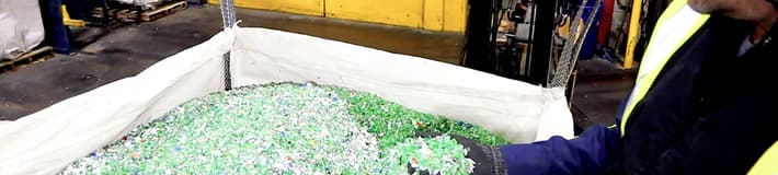 Shredded plastic bottles in a container