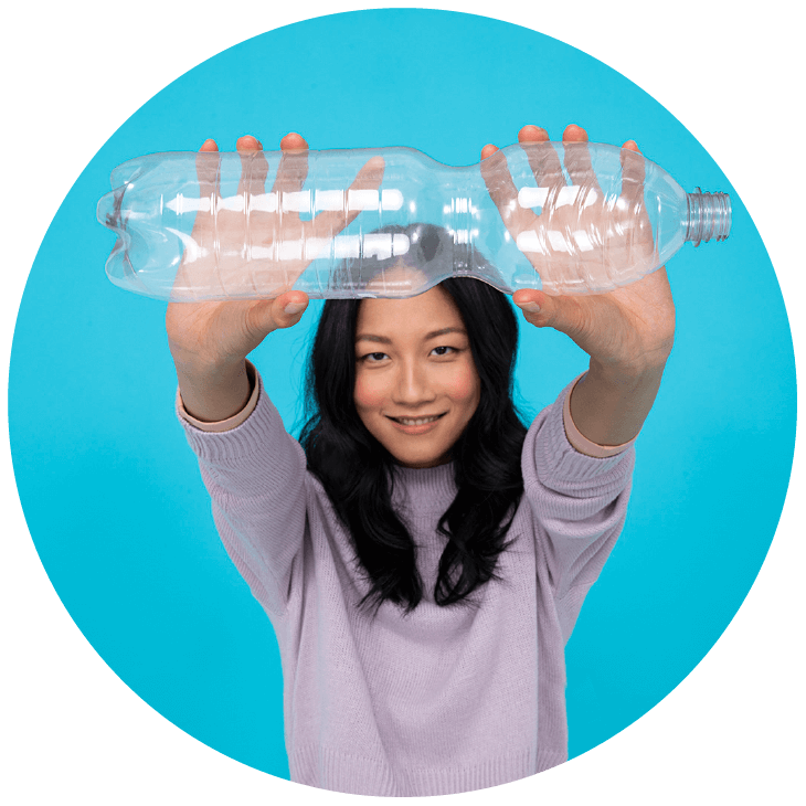 Woman holding a plastic bottle with outstretched arms